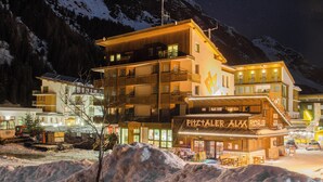 A multi-story hotel with balconies and a visible restaurant named "Piz Alux." - Alpine B&B (Sankt Leonhard im Pitztal)