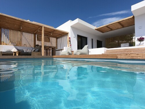 Luxury villa with large terrace, lounge area, pool, jacuzzi + magnificent sea view.