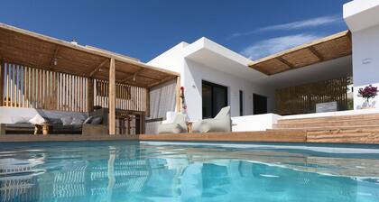 Luxury villa with large terrace, lounge area, pool, jacuzzi + magnificent sea view.