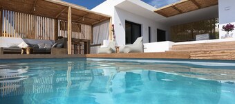 Luxury villa with large terrace, lounge area, pool, jacuzzi + magnificent sea view.