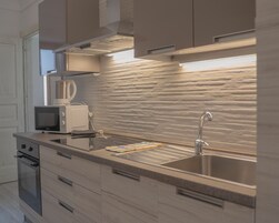 Comfort Apartment | Private kitchen | Fridge, stovetop, espresso maker, cookware/dishes/utensils