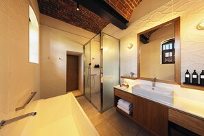 Separate tub and shower, free toiletries, hair dryer, slippers