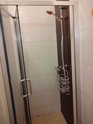Shower, towels, soap, toilet paper