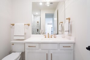 Shower, hair dryer, towels, soap