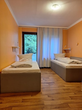 Twin Room, Balcony | Individually furnished, iron/ironing board, free WiFi, bed sheets