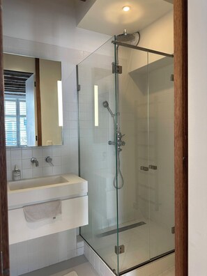 Shower, hair dryer, towels, soap