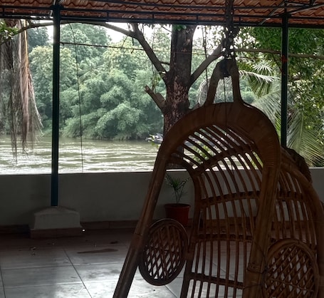 Terrace/patio. Tranquil Villa by River Peaceful stay by Homeyhuts