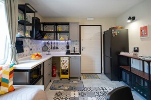 Fridge, microwave, toaster, cookware/dishes/utensils