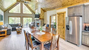 A spacious kitchen with a large island, wooden ceiling, and a built-in refrigerator. - 11 Mi to State Park: Home w/ Dock in Mill Spring! (Mill Spring)