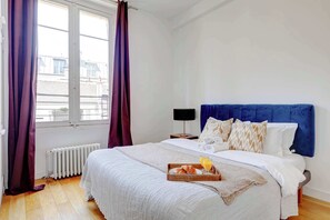 1 bedroom, desk, iron/ironing board, travel crib