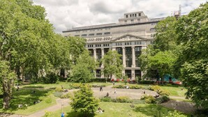 A large building with classical architecture, surrounded by a well-maintained park with pathways and greenery. - The Honourable - Bloomsbury Square By Frankie Says (London)