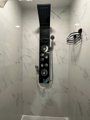 Shower, towels, soap, toilet paper