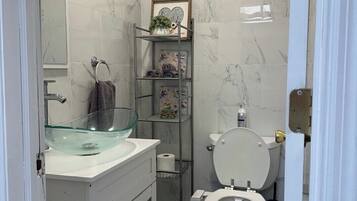 Shower, towels, soap, toilet paper