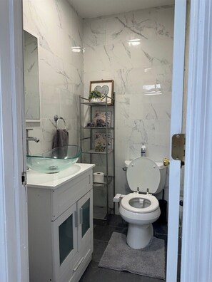 Shower, towels, soap, toilet paper