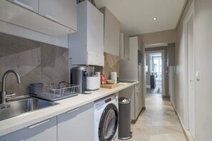 Fridge, microwave, stovetop, coffee/tea maker