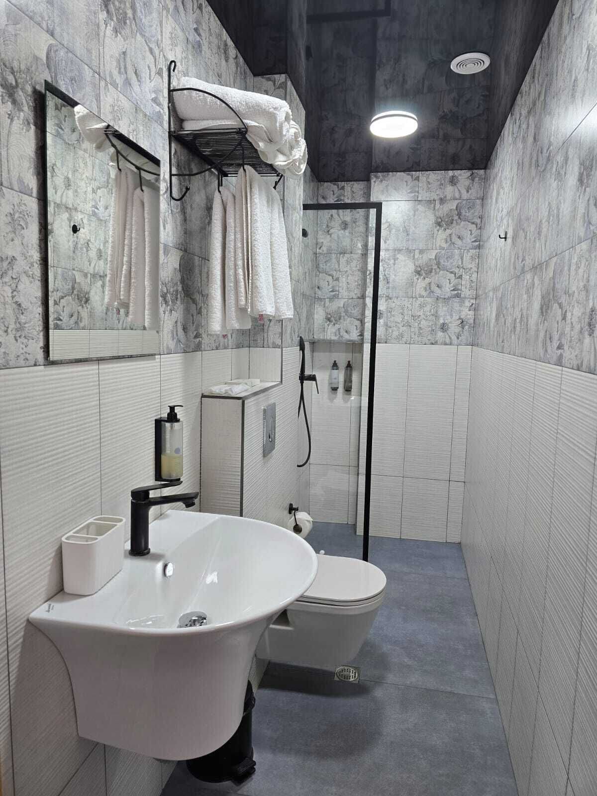 Shower, eco-friendly toiletries, hair dryer, towels