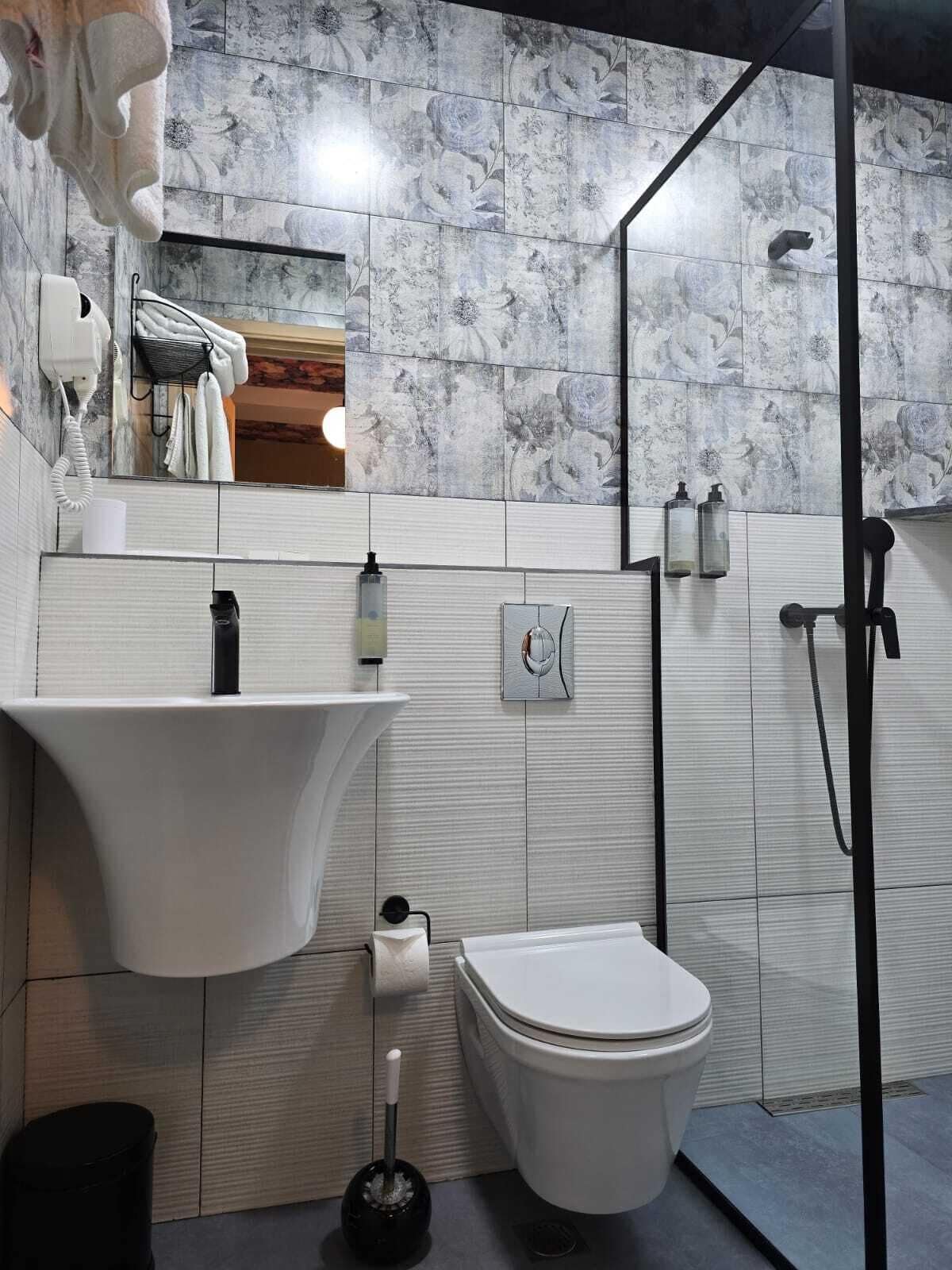 Shower, eco-friendly toiletries, hair dryer, towels