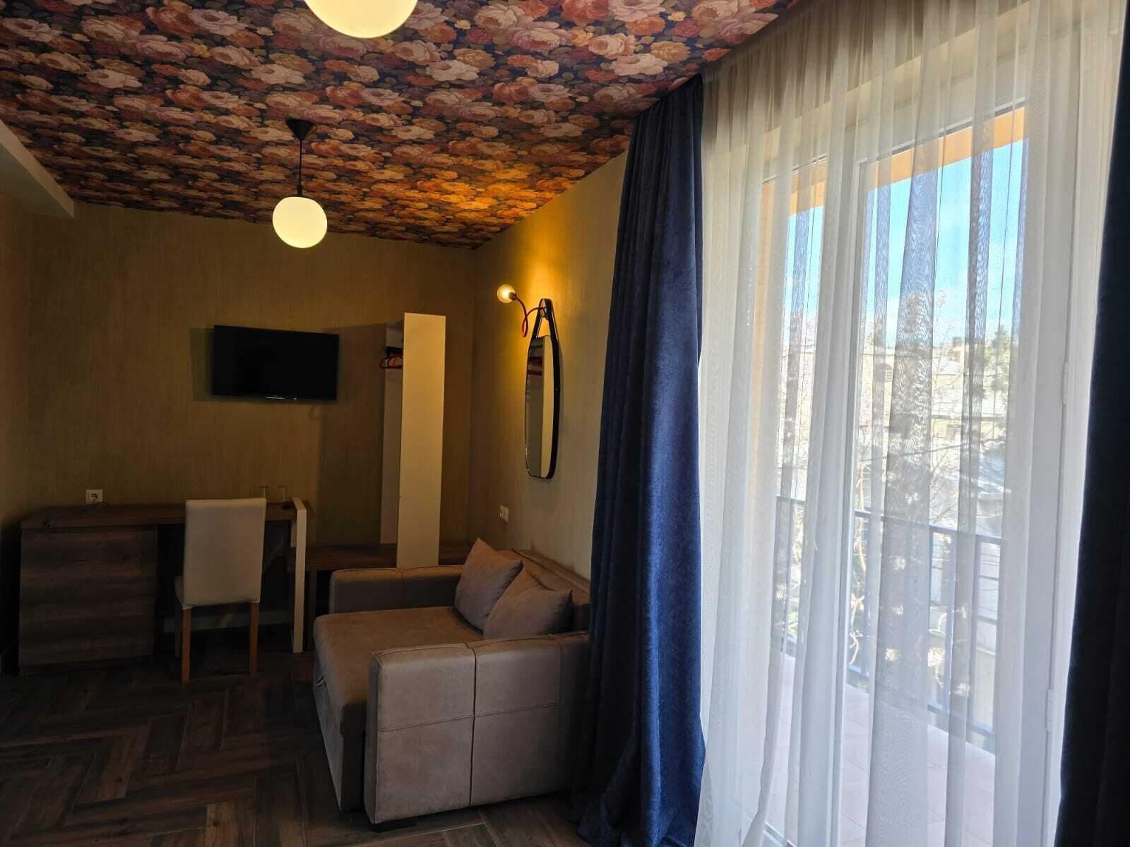 Deluxe Double or Twin Room | Living area | 90-cm Smart TV with digital channels, heated floors