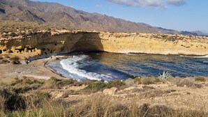 A coastal landscape with a rocky cliff and a clear blue sky. - Casa Soleada - Three Bedroom Apartment, Sleeps 6 (Pulpí)