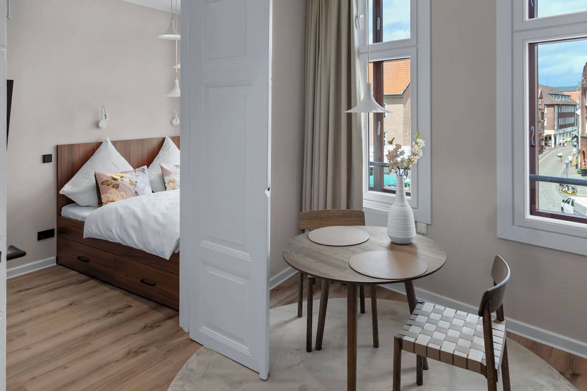 Departamento Deluxe, vista a la ciudad | Área de sala de estar
