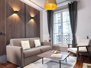 Signature Apartment, Courtyard View | Living area | 80-cm Smart TV with digital channels