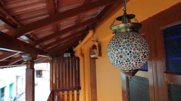 A hanging lantern with a floral pattern.