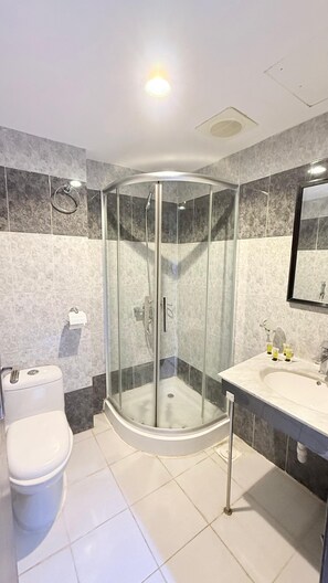 Rainfall showerhead, towels, soap, shampoo