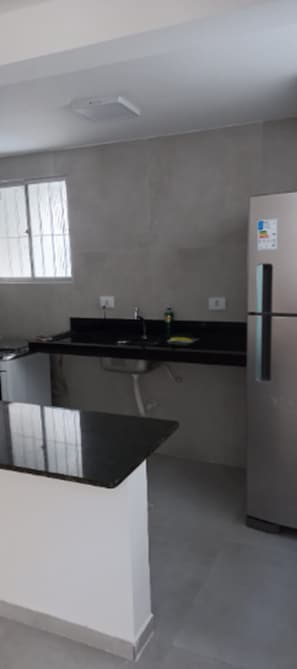 Fridge, stovetop, electric kettle, toaster