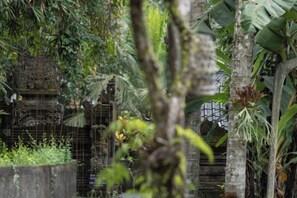 A traditional structure surrounded by dense foliage. - The Artini Dijiwa Ubud (Bali)