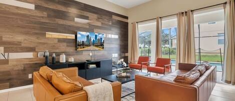 Huis, Meerdere bedden, toegang tot zwembad, uitzicht op zwembad (2621AB WH new) | Woonruimte | Een 42-inch flatscreentelevisie met digitale zenders