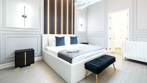 A modern bedroom with a large bed, bedside tables, a bench, and a white radiator. - Themed Kids' Rooms, Pool & Game Loft Near Disney (Kissimmee)