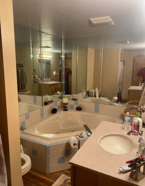Shower, jetted bath, towels, soap