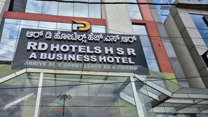 A sign for RD Hotels HSR A Business Hotel with a slogan "ARRIVE AS A GUEST LEAVE AS A FRIEND". - R D HOTELS HSR (Bengaluru)