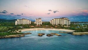 A resort with multiple high-rise buildings, a central pool area, and a surrounding landscaped area. - View Stunning Sunsets in this Ocean View 1 Br @ MVC Ko Olina Beach Club (Kapolei)