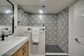 Shower, hair dryer, towels, toilet paper