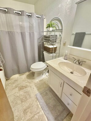 Jetted tub, hair dryer, towels, soap