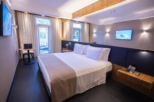Suíte estúdio superluxo, vista para o jardim | Comodidades do quarto