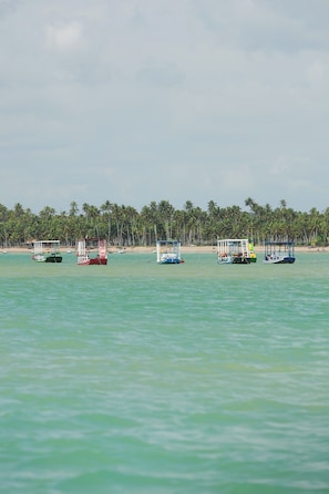 On the beach, beach umbrellas, beach towels, beach massages