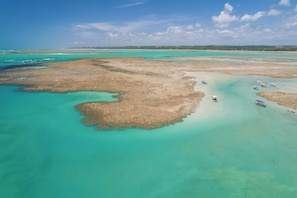 On the beach, beach umbrellas, beach towels, beach massages