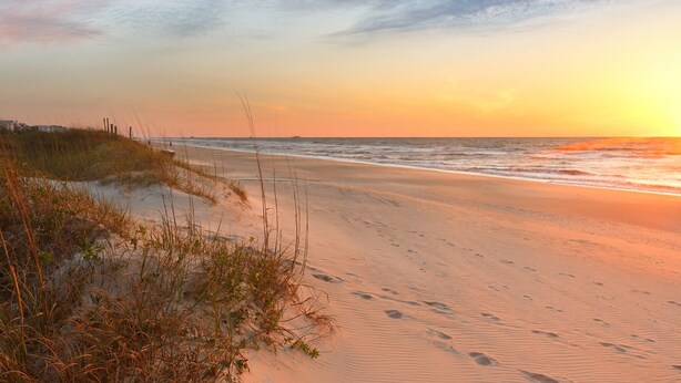 A beach with sand dunes and a sunset. - The Sweet Spot by Carolina Retreats (Carolina Beach)