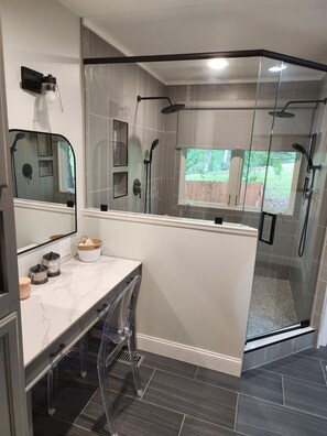 Shower, hair dryer, towels, toilet paper