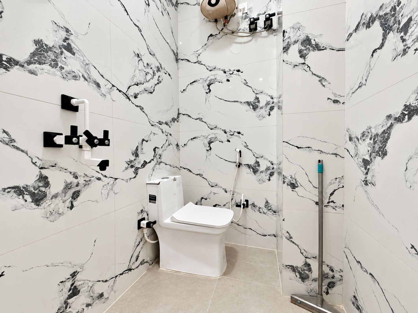 A bathroom with a toilet, a bidet, and a shower area.