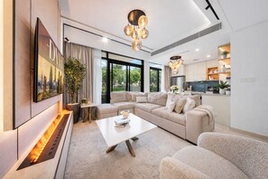 Signature Villa, Garden View | Living area | 55-inch Smart TV with digital channels, Netflix, streaming services