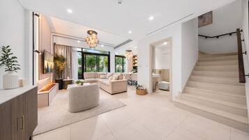 Signature Villa, Garden View | Living area | 55-inch Smart TV with digital channels, Netflix, streaming services