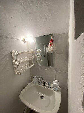 Shower, towels, soap, toilet paper