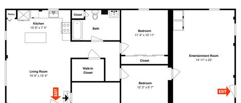 Planta baixa mostrando uma cozinha, sala de estar, dois quartos, um closet amplo e uma sala de entretenimento.