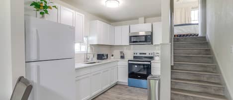 Fridge, microwave, stovetop, coffee/tea maker