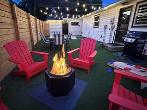 Outdoor dining - Raider Roost-Putting Green/Fire Pit/ Game Room Close to NWC & Downtown! (Orange City)