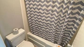 Combined shower/tub, towels, soap, shampoo