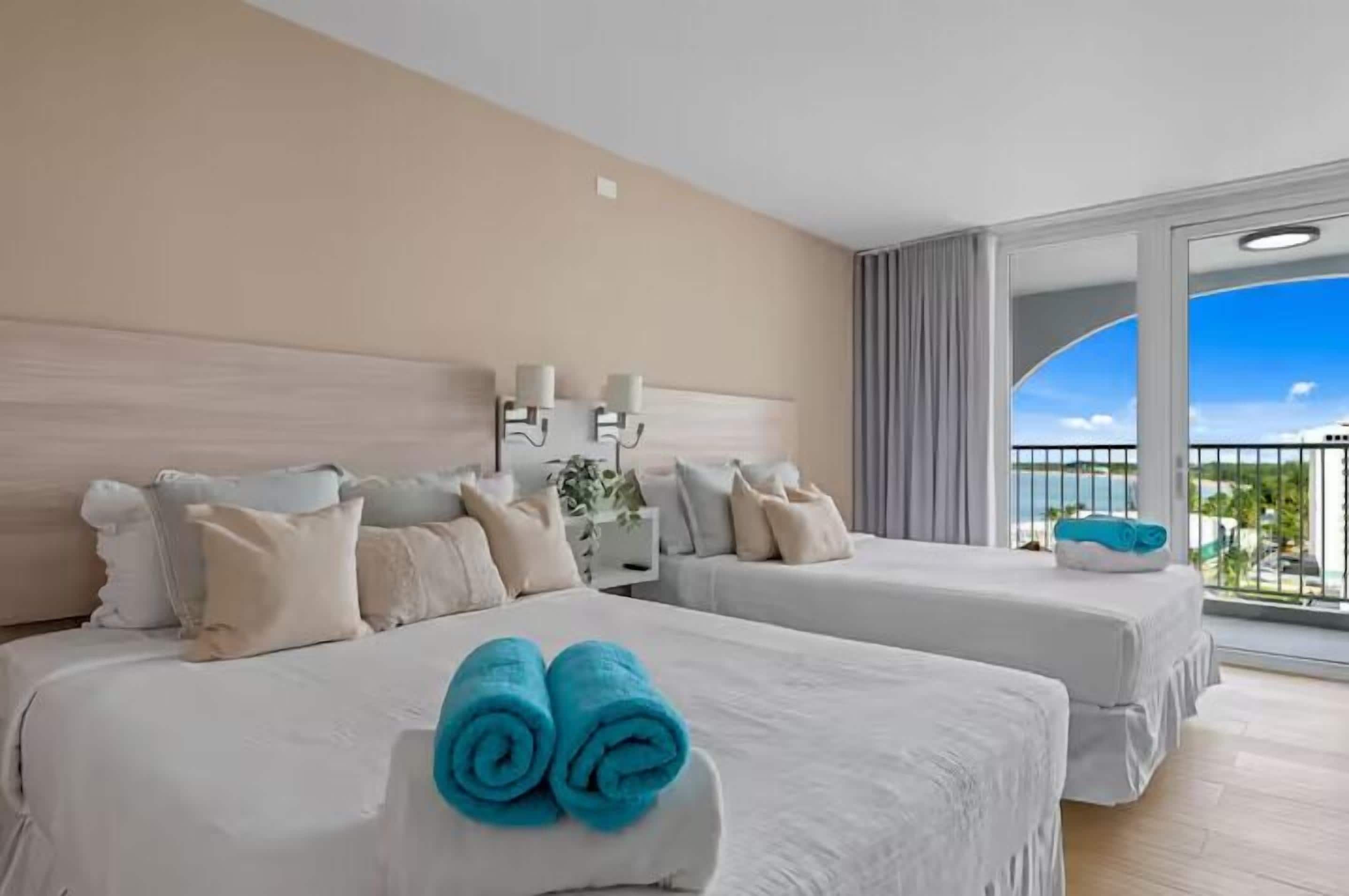 Family Studio, 2 Queen Beds, Partial Ocean View | Individually decorated, individually furnished, desk, laptop workspace